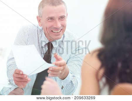 boss discusses with the assistant business documents in the offi