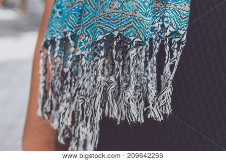 Yong woman hands with cashmere scarf. Bali island. Fashion shot.