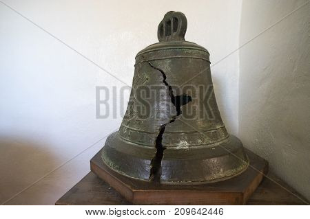 January 9, 2016 Goliad Texas USA: cracked historic chapel bell displayed at Presido la Bahia fort