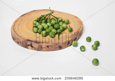 Turkey Berry (solanum Torvum) On Chopping Wooden Background