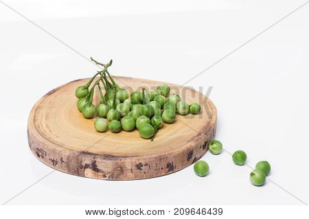 Turkey Berry (solanum Torvum) On Chopping Wooden Background