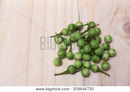 Turkey Berry (solanum Torvum Sw.) On A Wooden Floor