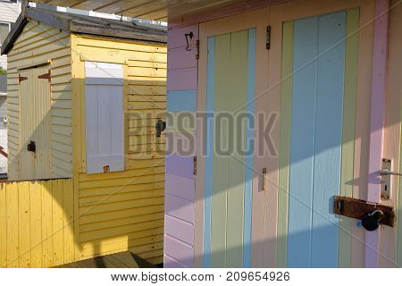 WHITSTABLE, UK - OCTOBER 15, 2017: Close-up on the entrance of colorful wooden huts