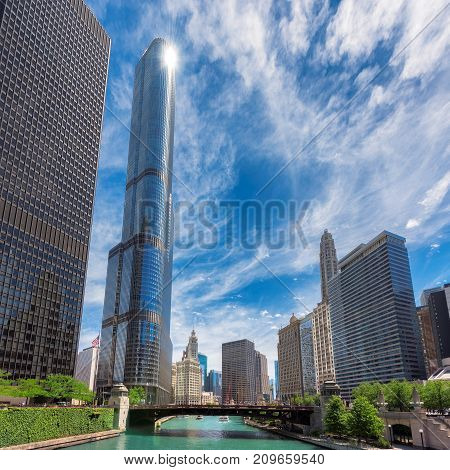 Chicago Skyline - downtown and Chicago River with bridges during sunny day.