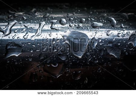 Water droplets on a stainless steel surface
