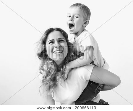 Portrait Of A Happy Mother And Her Young Son. Mother And Little Boy Play,
