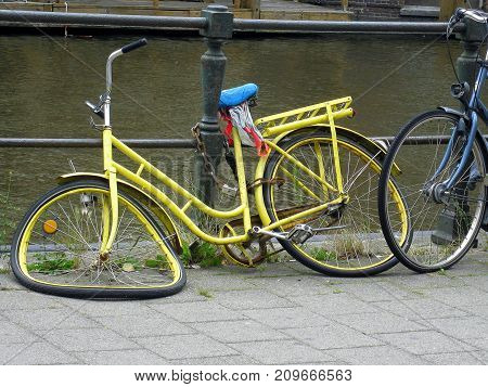 A bicycle is a wheeled vehicle driven by the muscular force of a person through the foot pedals