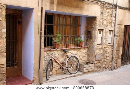 A bicycle is a wheeled vehicle driven by the muscular force of a person through the foot pedals