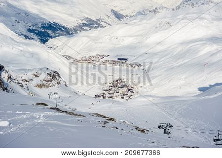 Alpine winter mountain landscape. French Alps covered with snow in sunny day. Val-d'Isere, France