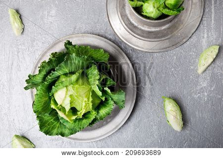 Fresh Green Cabbage In Metal Plate On Grey Background. Top View. Copy Space.