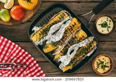 Grilled Corn On Wooden Table