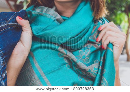 Yong woman hands with cashmere scarf. Bali island. Fashion shot.