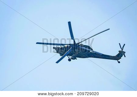 ROSTOV-ON-DON, RUSSIA - CIRCA AUGUST, 2017: Russian Air Force Mil Mi-28 Havoc military attack combat helicopter in gray camouflage flying detail exterior front close up aerial view