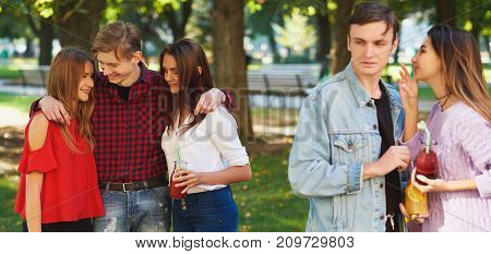 Jealousy and envy in friends relationship. Cheerful young people with detox cocktail having outdoor summer party