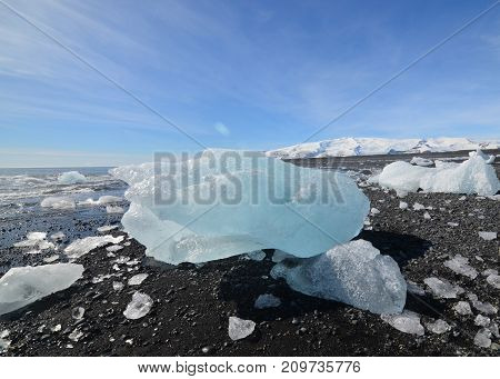 Breathtaking chunk of an iceberg on the beach