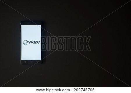 Los Angeles, USA, october 19, 2017: Waze logo on smartphone screen on black background.