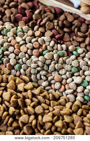 Dry pet food background - three kinds. Meat.