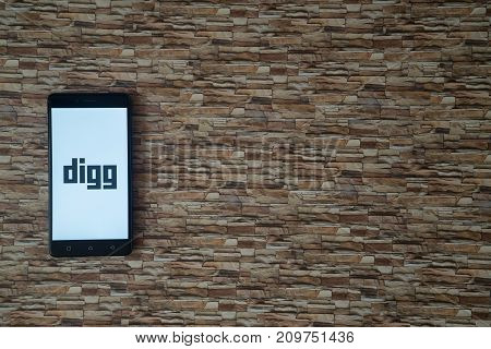 Los Angeles, USA, october 19, 2017: Digg logo on smartphone screen on stone facing background