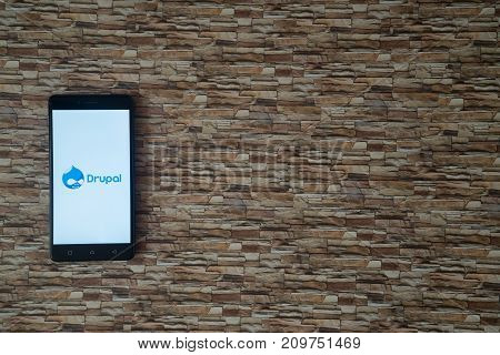 Los Angeles, USA, october 19, 2017: Drupal logo on smartphone screen on stone facing background