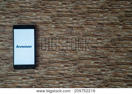 Los Angeles, USA, october 19, 2017: Lenovo logo on smartphone screen on stone facing background