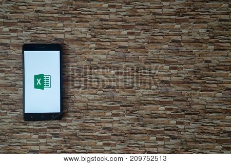 Los Angeles, USA, october 19, 2017: Microsoft office excel logo on smartphone screen on stone facing background