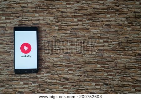 Los Angeles, USA, october 19, 2017: Musical.ly logo on smartphone screen on stone facing background