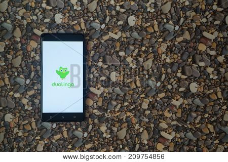 Los Angeles, USA, october 18, 2017: Duolingo logo on smartphone on background of small stones