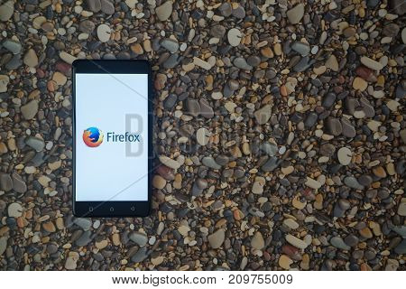 Los Angeles, USA, october 18, 2017: Mozilla firefox logo on smartphone on background of small stones