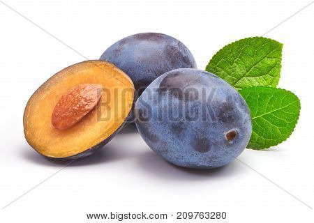 Isolated Plums. One And A Half Of Blue Plum Fruit With Leaves Isolated On White Background