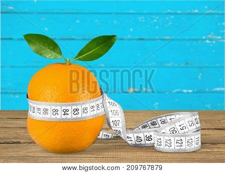 Fresh orange measuring tape healthy lifestyle low calorie natural food