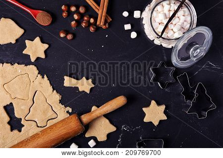 Ingredients for Christmas cooking. Uncooked cookies, doudh, marshmallow, nuts. Flat lay