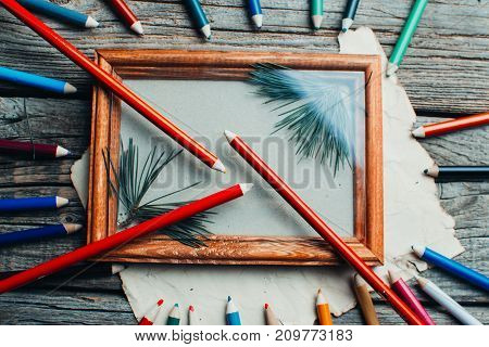 Christmas Composition ,photo Frame On The Wooden Table With Tree Branches With Pencils