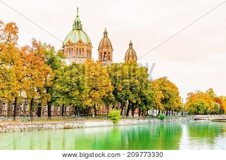 View on Isar river an St. Anna churchautumn landscape by Lehel in Munich