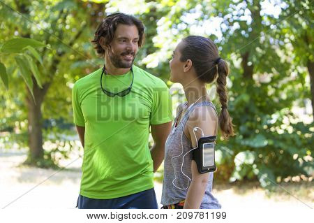Smiling Couple Stretching Outdoors