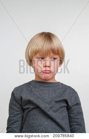 New cool vertical emotional portrait of caucasian boy
