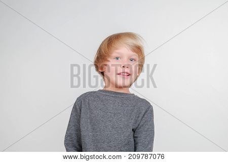 New horisontal emotional portrait of caucasian boy. Handsome happy child, isolated on white background