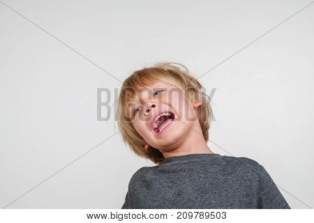 Fine horisontal portrait of handsome happy child
