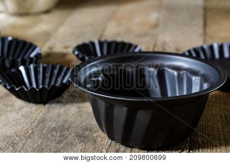 Old Baking Molds On An Old Kitchen Table. Baking Accessories In The Kitchen.
