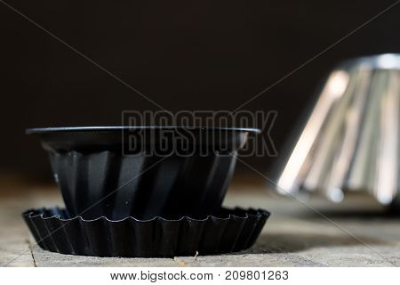 Old Baking Molds On An Old Kitchen Table. Baking Accessories In The Kitchen.