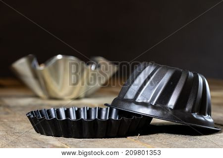 Old Baking Molds On An Old Kitchen Table. Baking Accessories In The Kitchen.