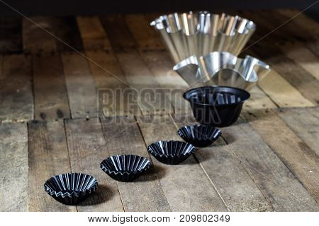 Old Baking Molds On An Old Kitchen Table. Baking Accessories In The Kitchen.