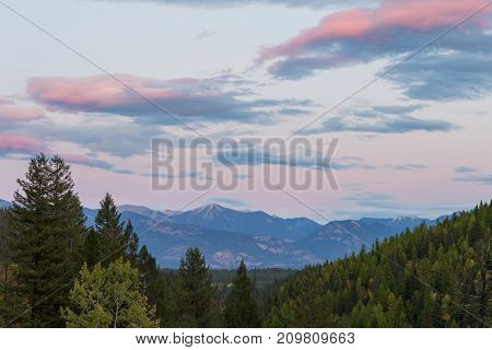The sun sets over the Kootenay Rocky Mountains near Panorama and Invermere BC.