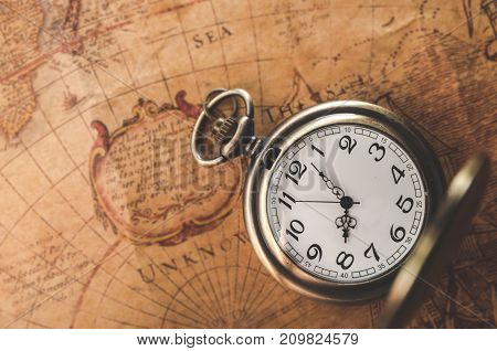 pocket watch or pendant watch on vintage map background (watch)