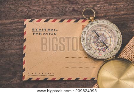 Vintage compass on the very old paper or letter envolope