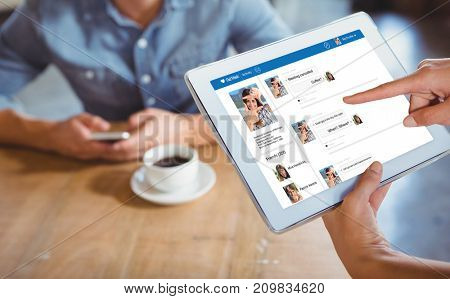 Cropped image of person using 3D tablet computer in cafe