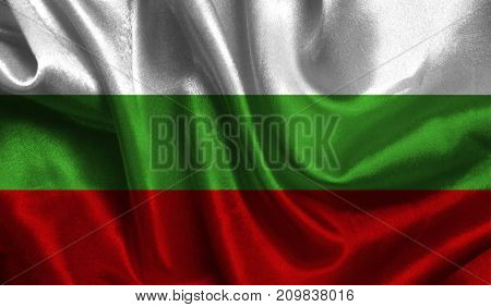 Realistic flag of Bulgaria on the wavy surface of fabric. This flag can be used in design.