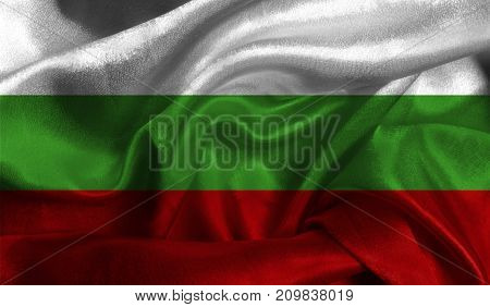 Realistic flag of Bulgaria on the wavy surface of fabric. This flag can be used in design.