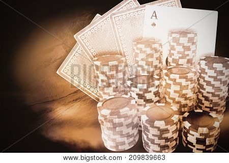 Computer generated 3D image of gambling chips against thunderstrom over cityscape
