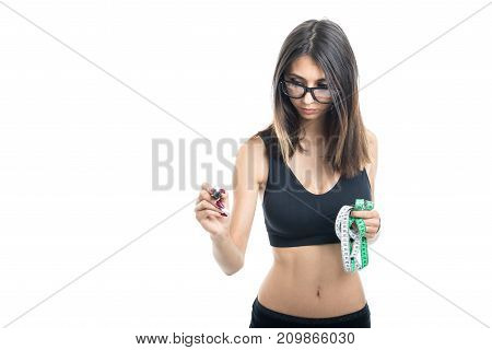 Fitt Girl Holding Measuring Tape And Writing
