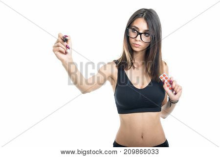 Fitt Girl Holding Tablet Blister And Writing
